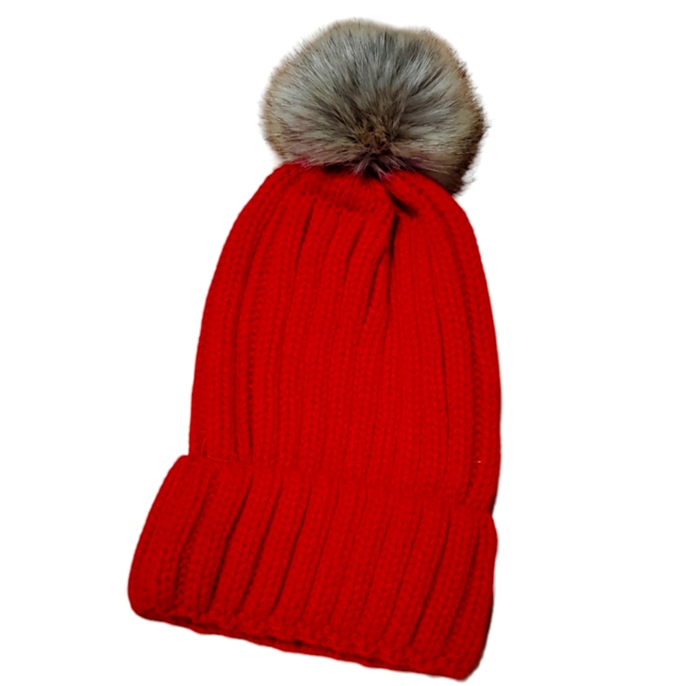 Red knit hat with single tan pom